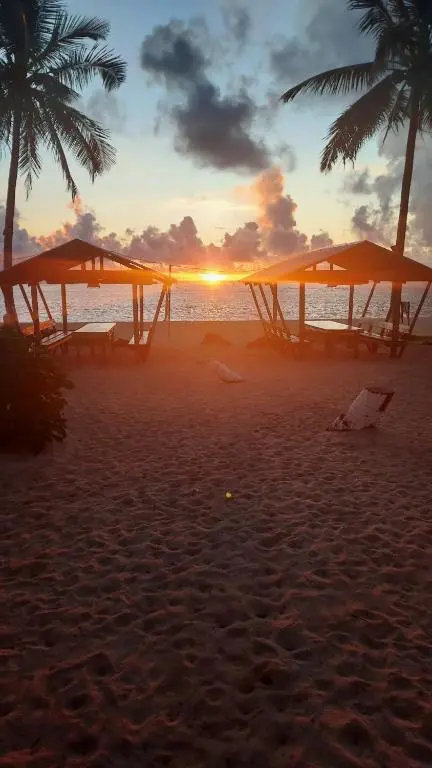 Golden-hour light at Alegria Beach on Siargao Island's northeast coast, Philippines