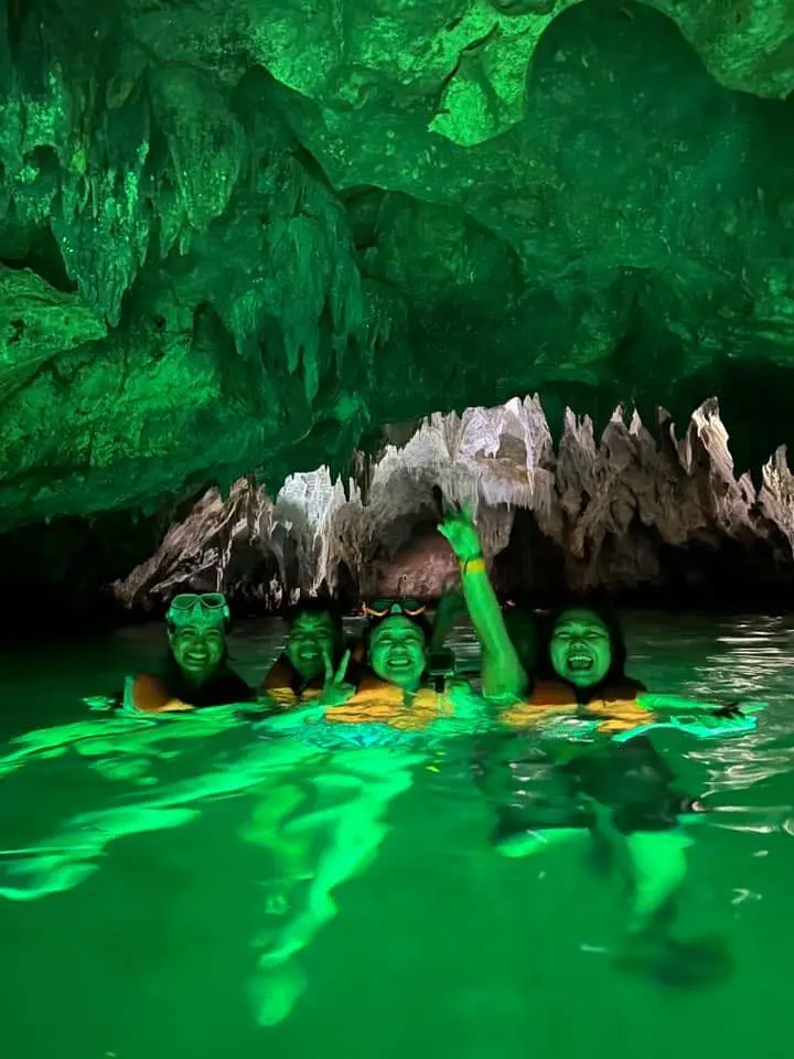 Hagukan Cave low-tide entrance at Sohoton Cove, Bucas Grande Island, Siargao, Philippines — limestone cave accessed by kayak