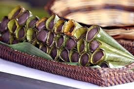 Sayongsong — traditional Filipino steamed sweet rice cake in cone-shaped banana leaves from Surigao del Norte