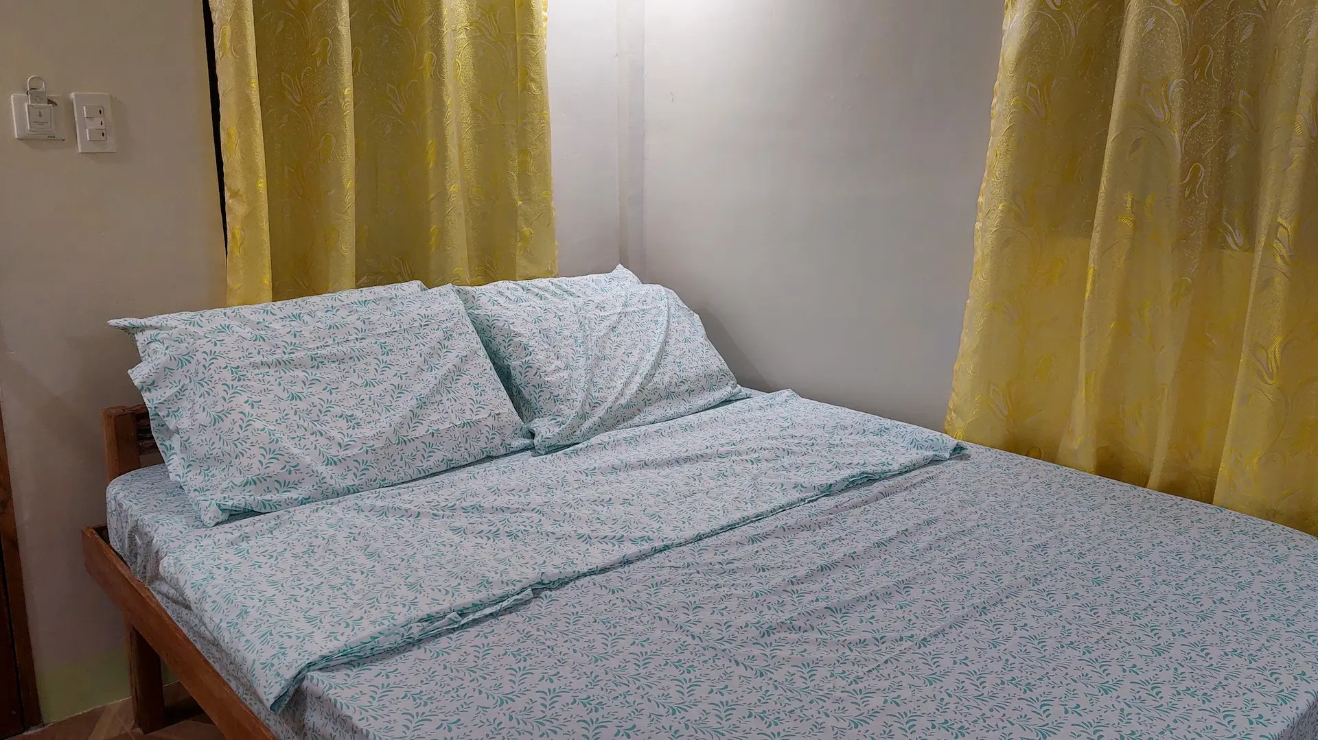 Cozy Double Room double bed with white linens and pillows